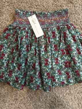 NWT!! PEEK AREN’T YOU CURIOUS Pixie Smocked Tiered skirt. Size 6/7.